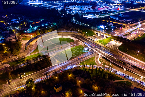 Image of Night Aerial view of a freeway intersection traffic trails in ni