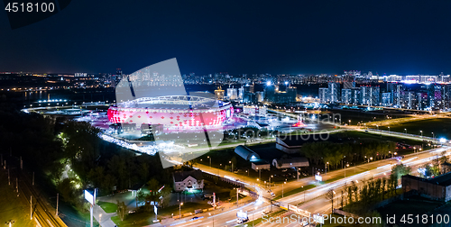 Image of Night Aerial view of a freeway intersection and football stadium