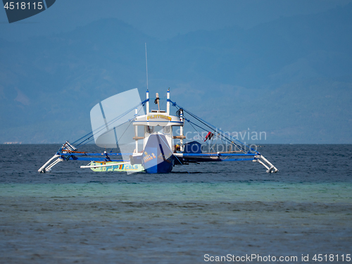 Image of Outrigger fishing boat in the Philippines