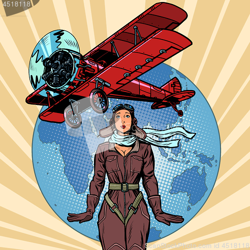 Image of woman pilot of a vintage biplane airplane