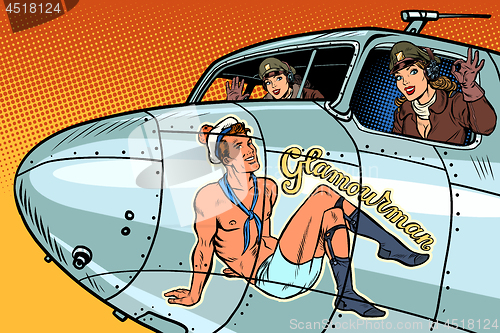 Image of women pilots girls. Pinup man on the fuselage of a retro bomber