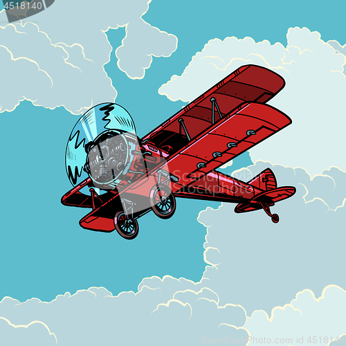 Image of retro biplane plane flying in the clouds