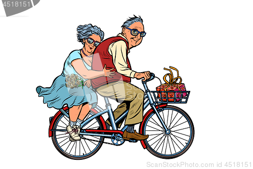 Image of old man and woman couple in love, riding a bike