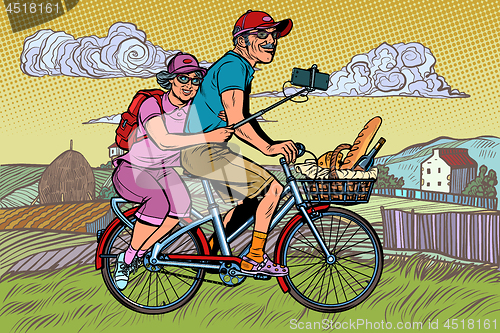 Image of old man and old lady travelers on bike, selfie on smartphone