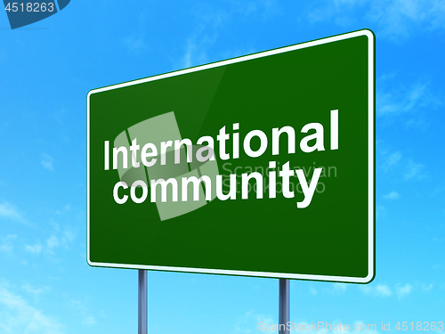 Image of Political concept: International Community on road sign background