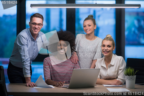 Image of Multiethnic startup business team in night office