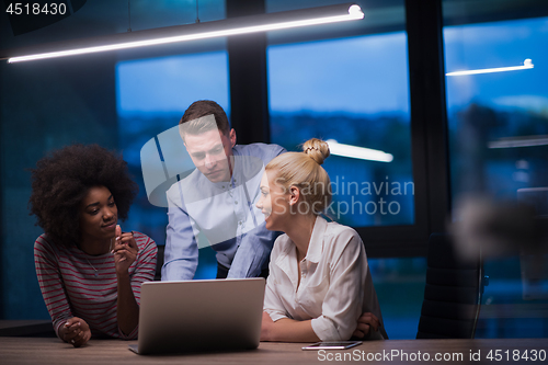 Image of Multiethnic startup business team in night office