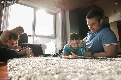 Image of young couple spending time with kids