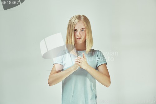 Image of Young serious thoughtful business woman. Doubt concept.