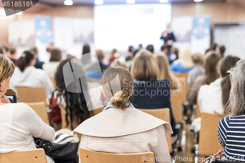 Image of Business speaker giving a talk at business conference event.