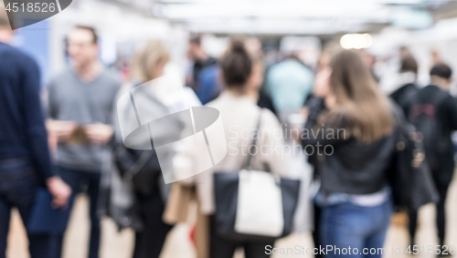 Image of Blured image of businesspeople socializing and networking during coffee break at conference meeting.