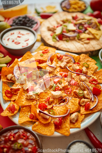 Image of An overhead photo of an assortment of many different Mexican foods on a table