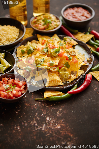 Image of Fresh yellow corn nacho chips on ceramic plate