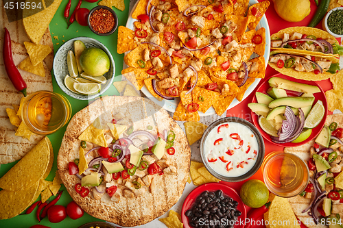 Image of An overhead photo of an assortment of many different Mexican foods on a table