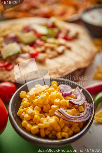 Image of Close up on corn seeds with various freshly made Mexican foods assortment