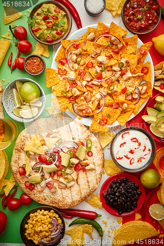 Image of An overhead photo of an assortment of many different Mexican foods on a table