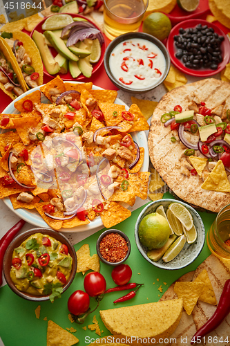 Image of An overhead photo of an assortment of many different Mexican foods on a table