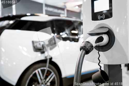 Image of Electric car getting recharged at station