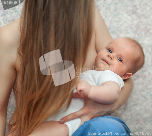 Image of Baby in hands of loving and caring mother