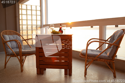 Image of Fruits and wine and sunset