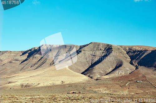 Image of Volcanic hills and blue sky