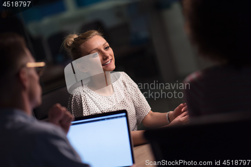 Image of Multiethnic startup business team in night office