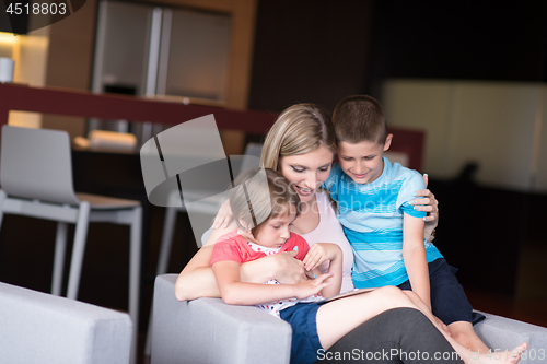 Image of Young Family Using A Tablet To Make Future Plans