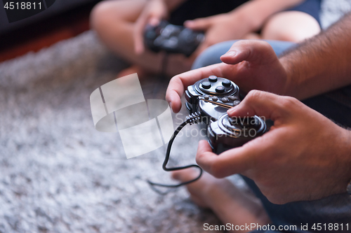 Image of Happy family playing a video game