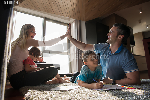 Image of young couple spending time with kids