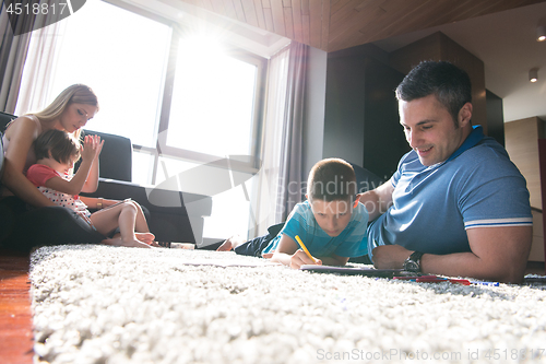 Image of young couple spending time with kids