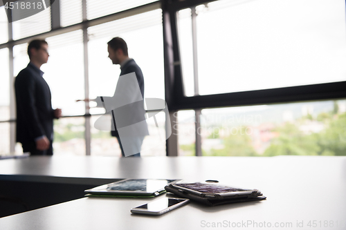 Image of cloasing the deal in modern office interior