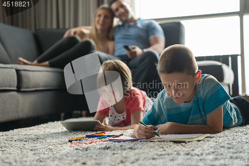 Image of young couple spending time with kids