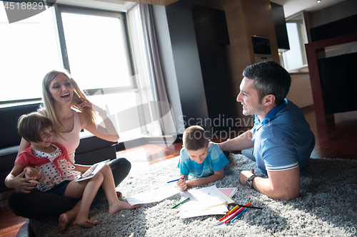 Image of young couple spending time with kids