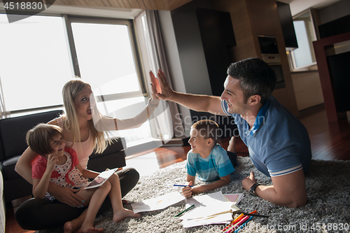 Image of young couple spending time with kids