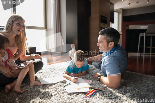 Image of young couple spending time with kids