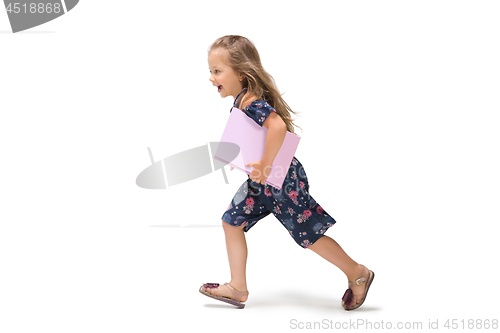 Image of Smiling cute toddler girl three years running over white background