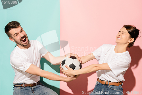 Image of The unhappy and angry fans on colored blue and pink background.