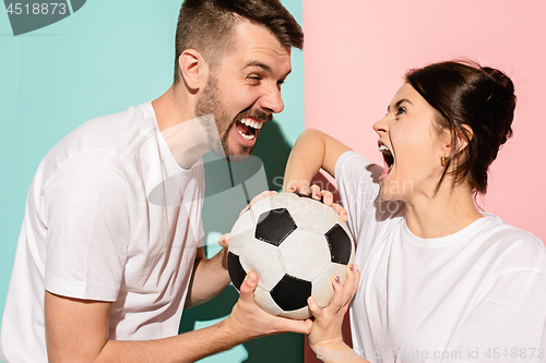 Image of The unhappy and angry fans on colored blue and pink background.