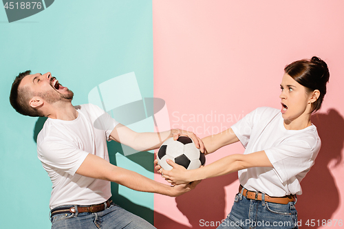 Image of The unhappy and angry fans on colored blue and pink background.