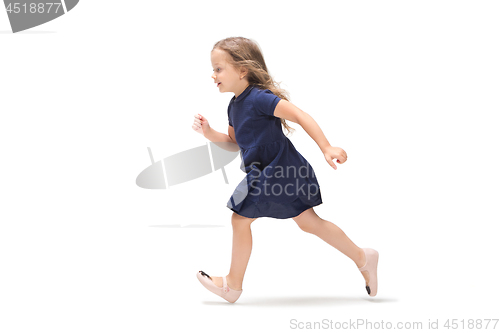 Image of Smiling cute toddler girl three years running over white background