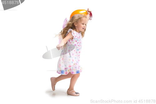 Image of Smiling cute toddler girl three years running over white background