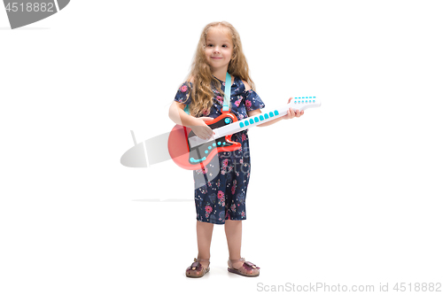 Image of Smiling cute toddler girl three years singing over white background