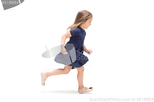 Image of Smiling cute toddler girl three years running over white background