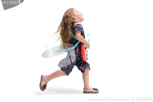 Image of Smiling cute toddler girl three years running over white background