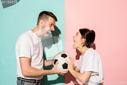 Image of The unhappy and angry fans on colored blue and pink background.