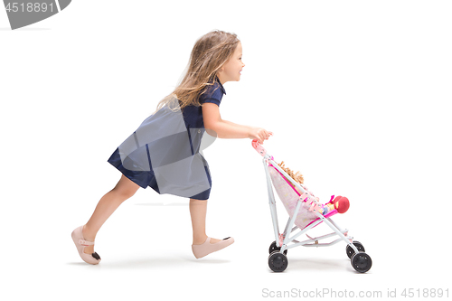 Image of Smiling cute toddler girl three years running over white background