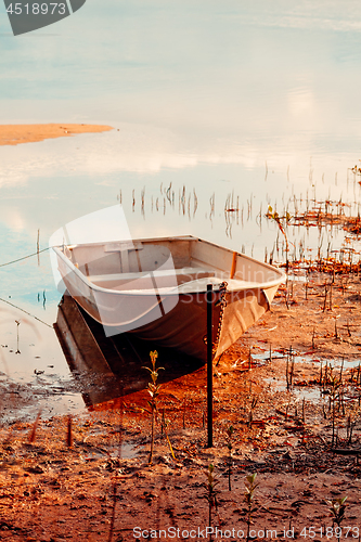 Image of Row boat in the shallows