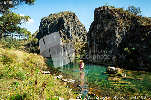 Image of Woman wading in  one of the spectacular gorges of Snowy Mountains Australia