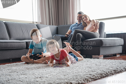 Image of couple spending time with kids