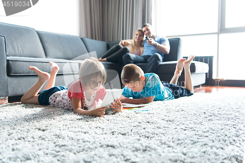 Image of young couple spending time with kids